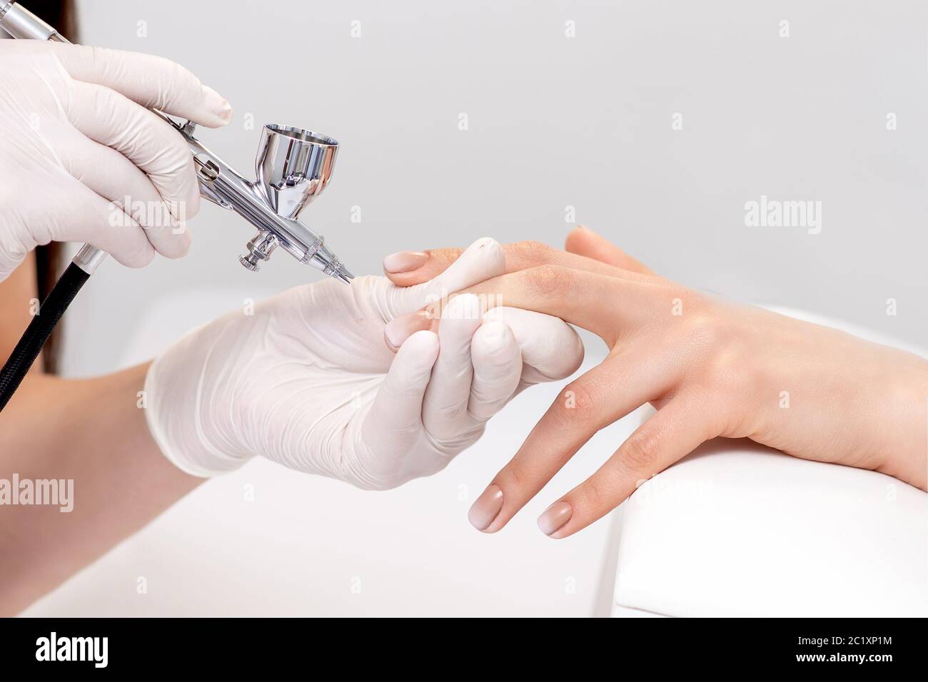Manicure Master Is Painting Finger Nails In Beige Color Using Airbrush Woman Getting Fingernail Manicure Stock Photo Alamy,Average Life Of A Cat Uk