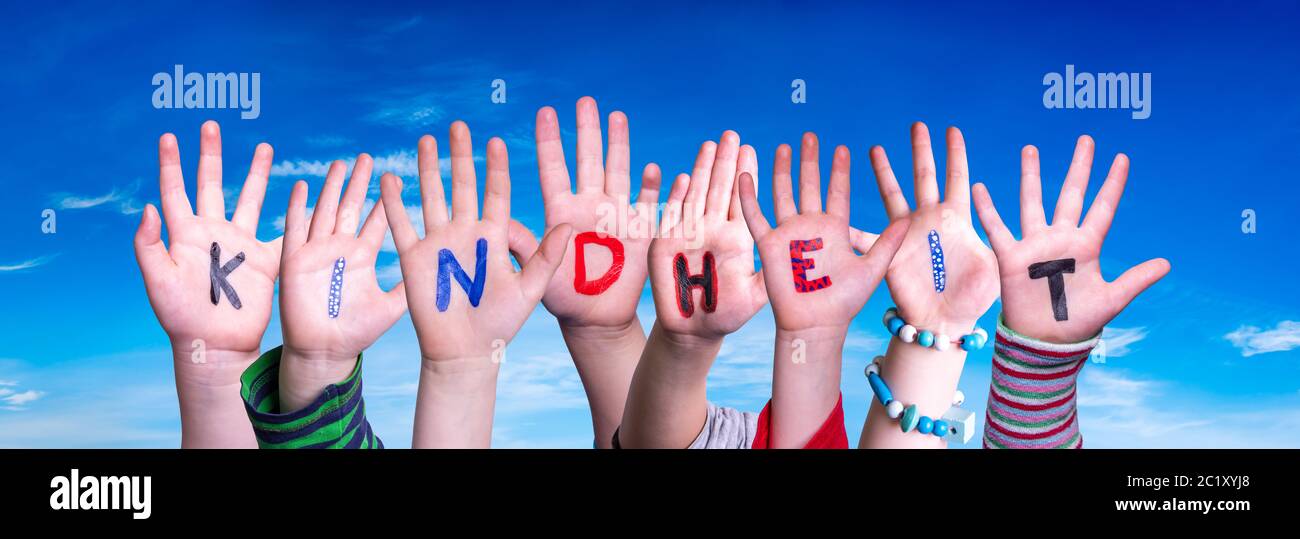 Children Hands Building Word Kindheit Means Childhood, Blue Sky Stock Photo
