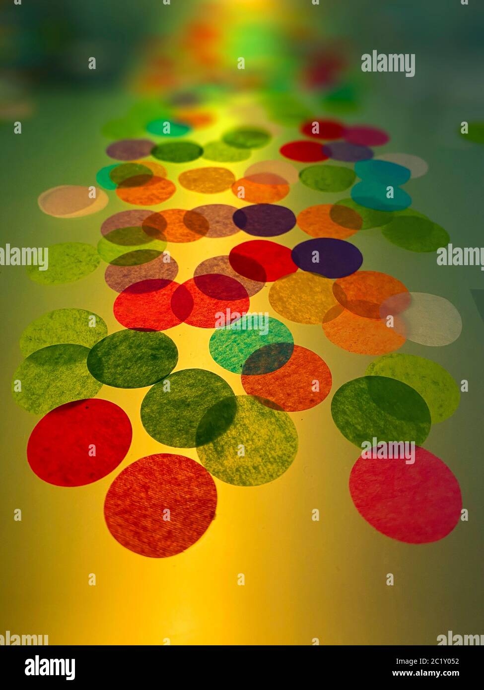 Party lights. An amazing display of vivid colour and decorations for parties and events. Paper discs are lit from below to make a delightful artwork i Stock Photo