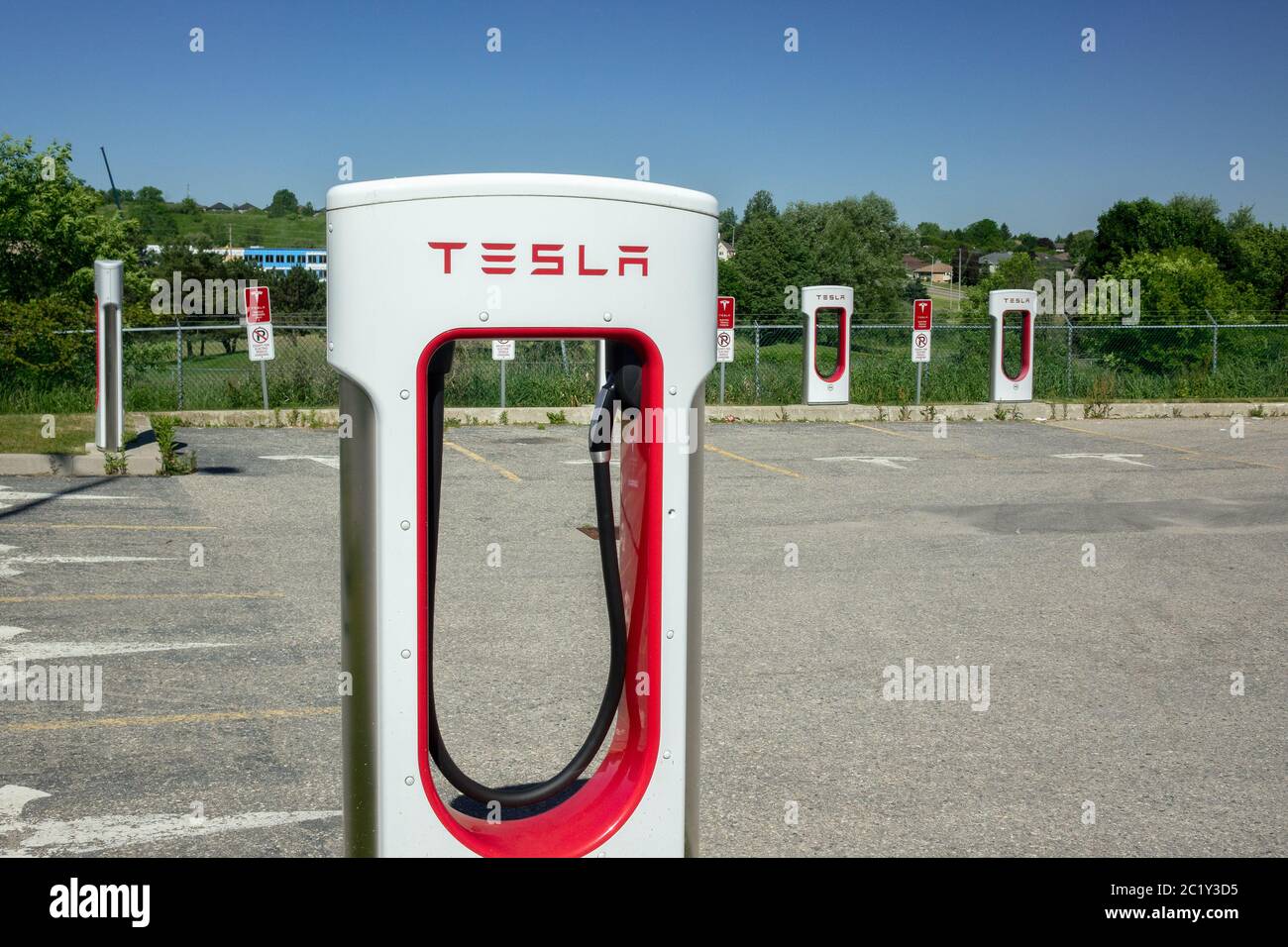 Tesla Electric Car Charging Station Supercharging Network In Woodstock Ontario Canada Parking Sign Stock Photo