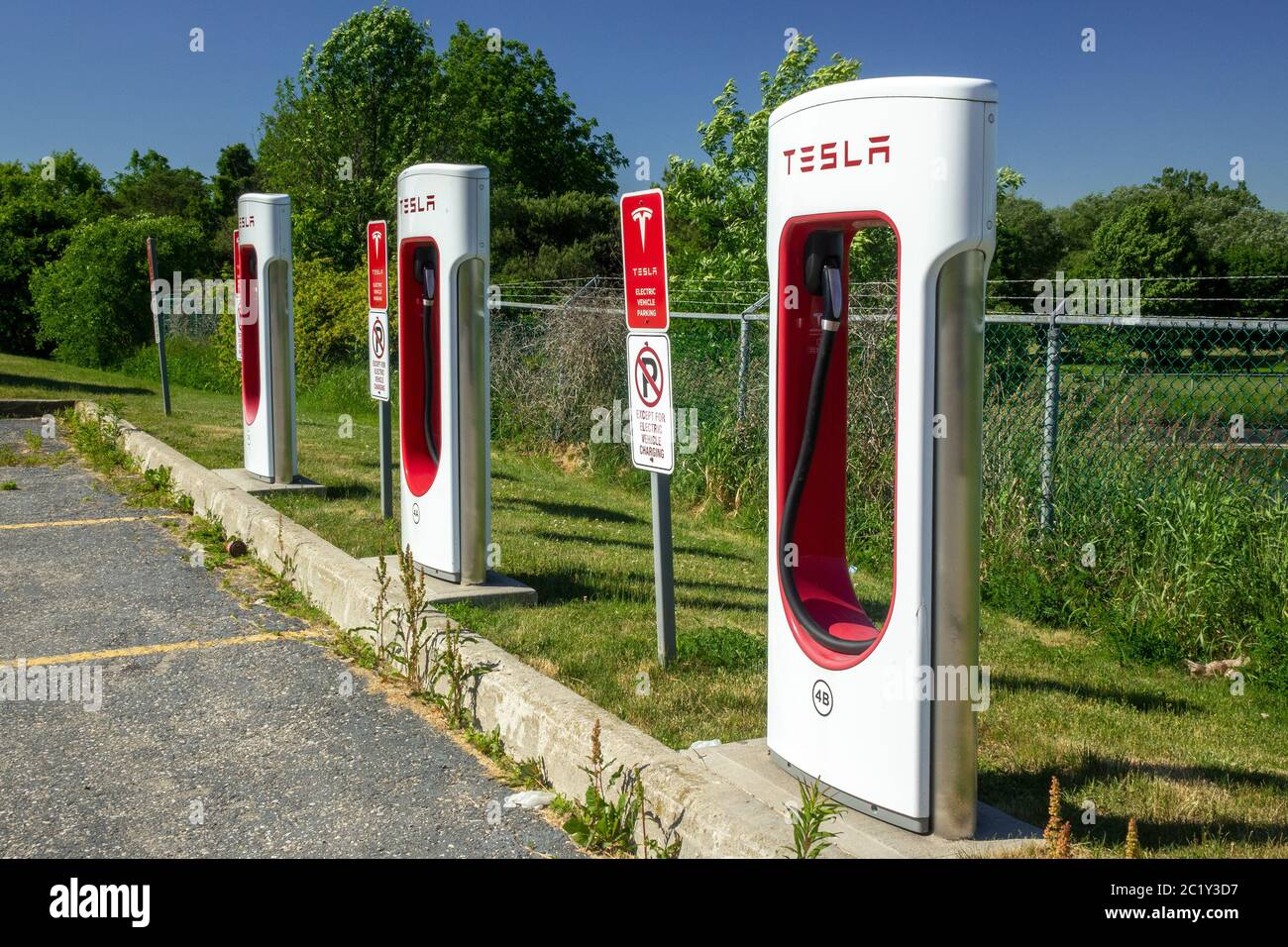 Tesla Electric Car Charging Station Supercharging Network In Woodstock Ontario Canada Parking Sign Stock Photo