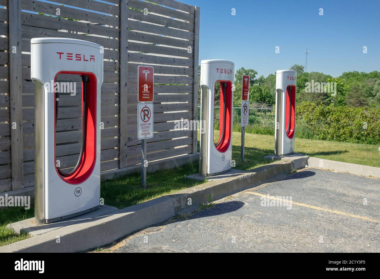Tesla Electric Vehicle Charging Station Supercharging Network In Woodstock Ontario Canada Stock Photo