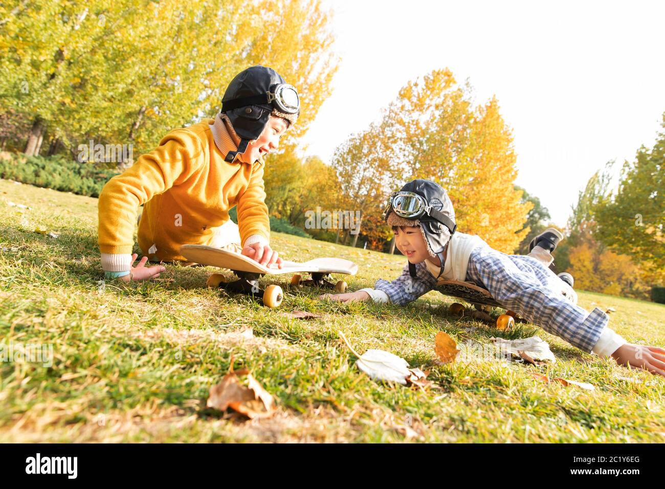 Happy child playing park grass hi-res stock photography and images - Alamy