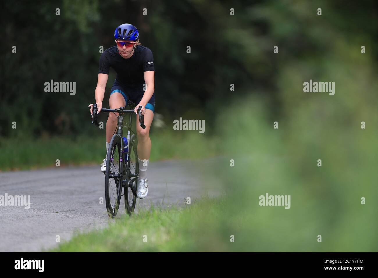 Triathlete Olivia Mathias during a training session on a disused airfield in Lincoln. Stock Photo