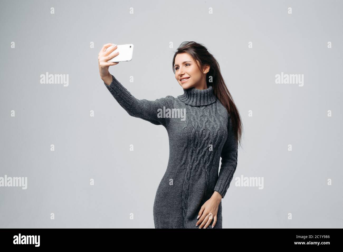 Attractive young woman taking selfie Stock Photo - Alamy