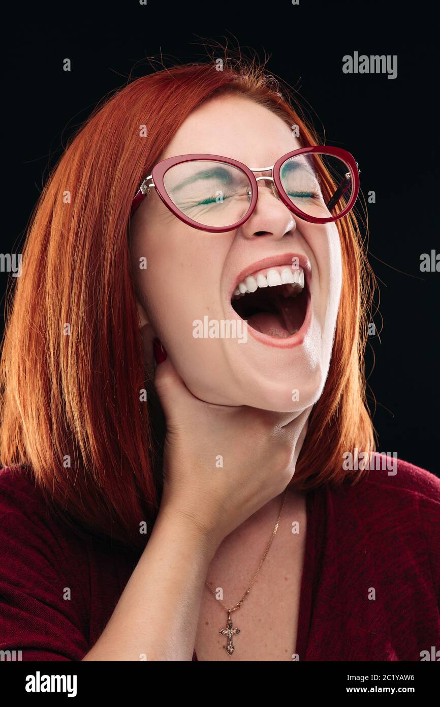 Woman in spectacles having sore throat, she holding hand on neck. Stock Photo