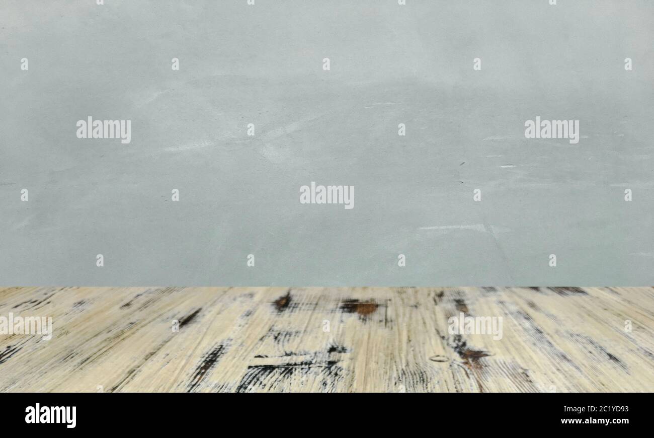 washed wood table with concrete texture background. Stock Photo
