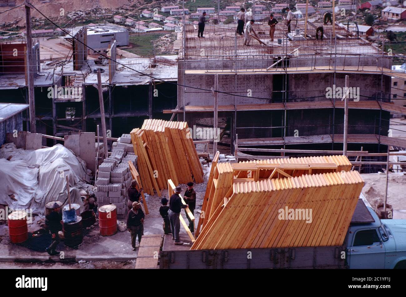Photograph taken on February 1969 of workers in a residential construction site for new Jewish immigrants in Ir Ganim G - a neighborhood in southwestern Jerusalem Israel Stock Photo