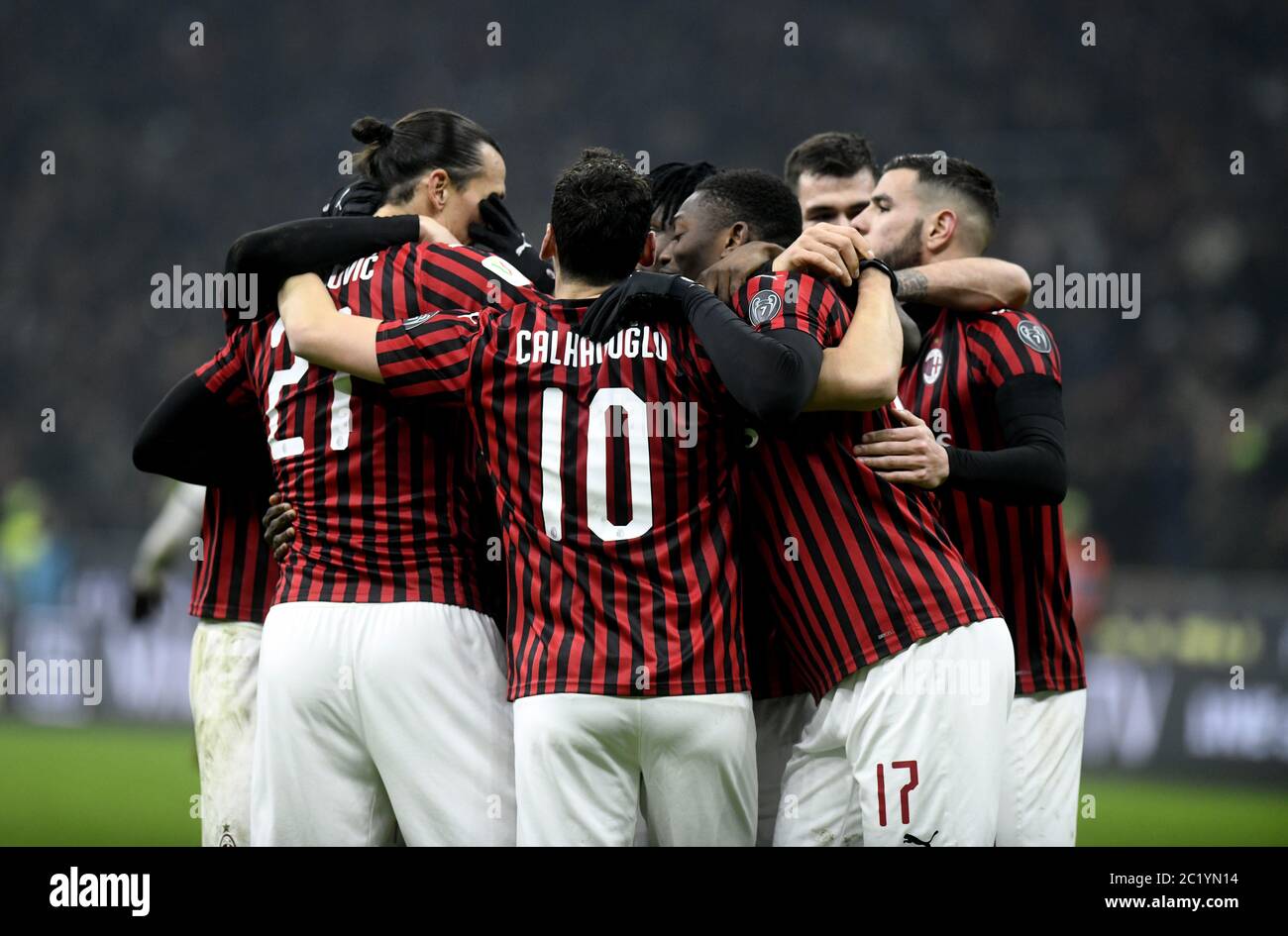 AC Milan soccerac milan team players embrace to celebrate the win goal scored, at the san siro soccer stadium at night, in Milan. Stock Photo