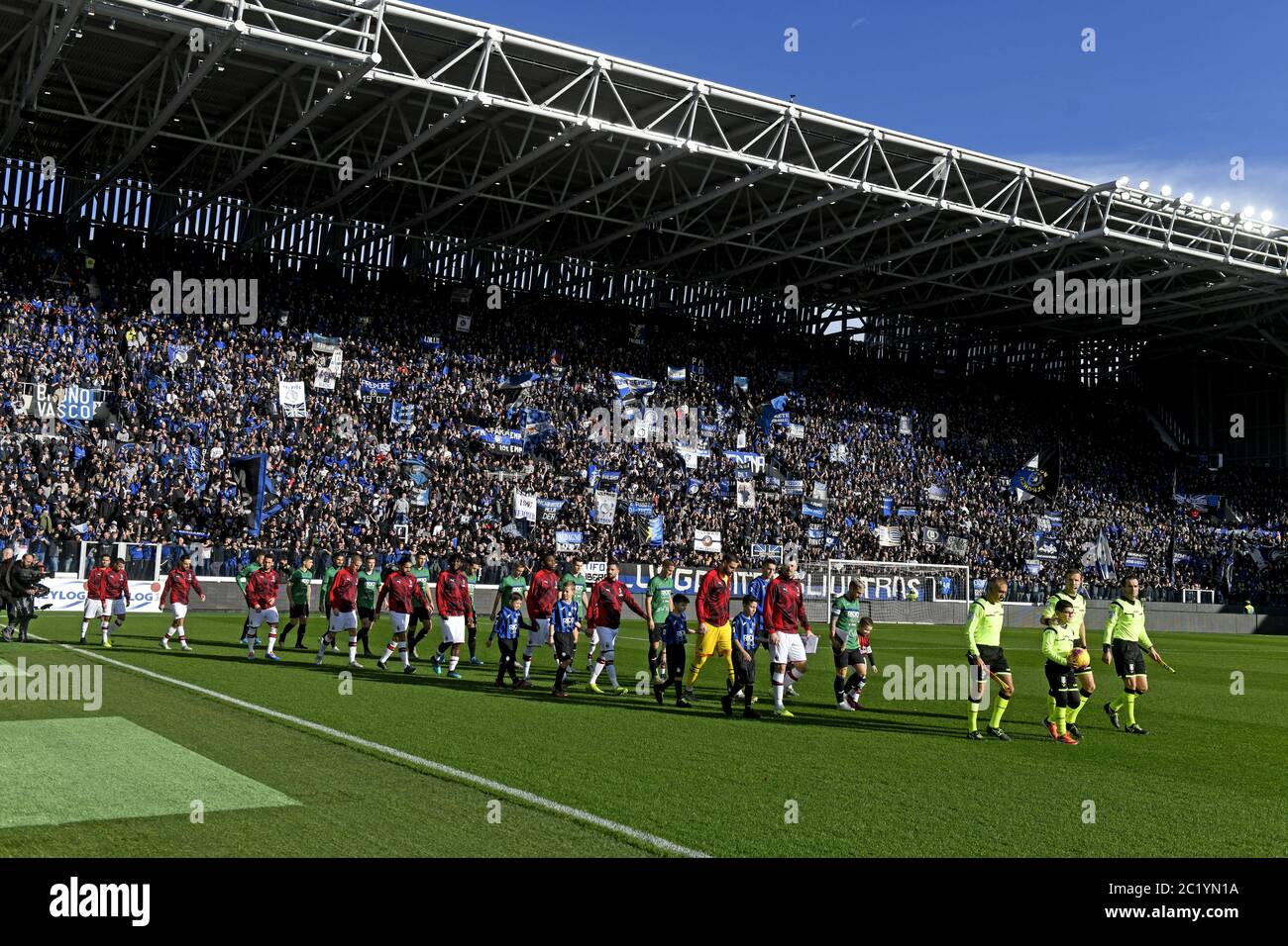 Atalanta and AC Milan teams enter the field at the renovated Gewiss stadium, in Bergamo. Stock Photo