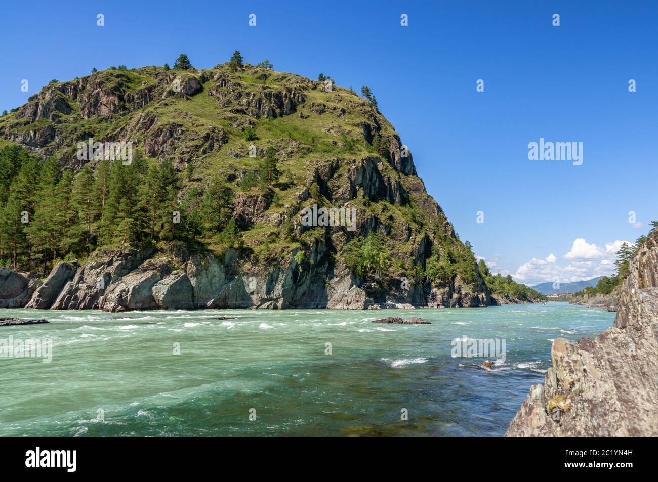 Katun river in Altai flows between the mountains covered with greenery Stock Photo