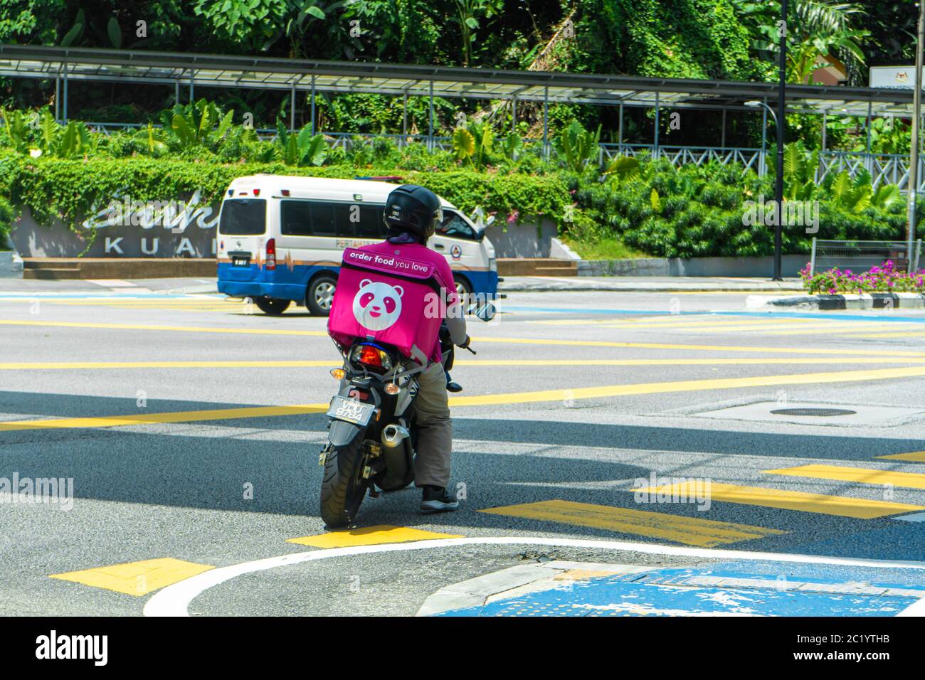 Courier Of A Popular Food Delivery Service In Malaysia On A Bike Food Ordering Home Stock Photo Alamy
