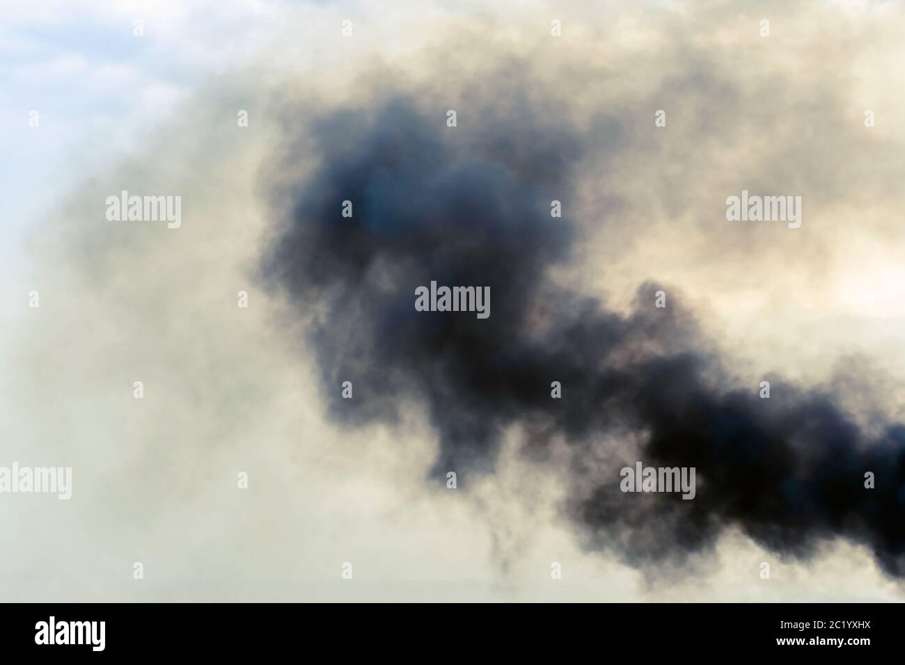 Exhaust pipe of ferry boat with black thick smoke coming out and sky ...