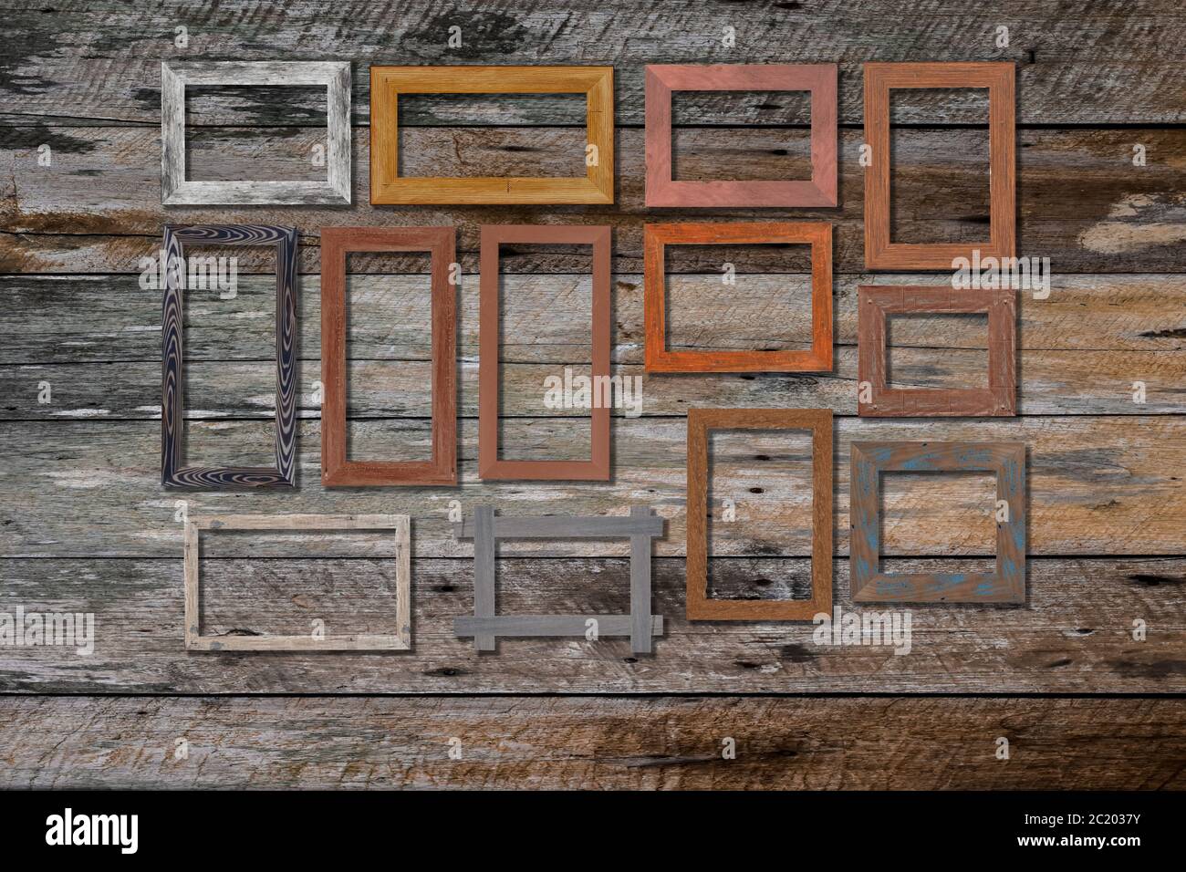 Vintage photo frames on wood wall for interior or background. Stock Photo