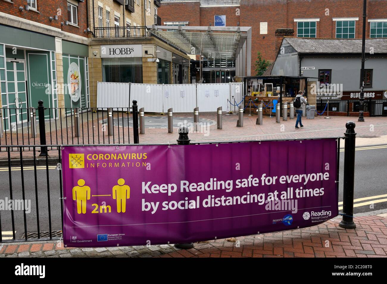 Reading Council advisory banner in front of entrance to The Oracle shopping centre, screened off in the rear of pic. Easing of Coronavirus lockdown, R Stock Photo