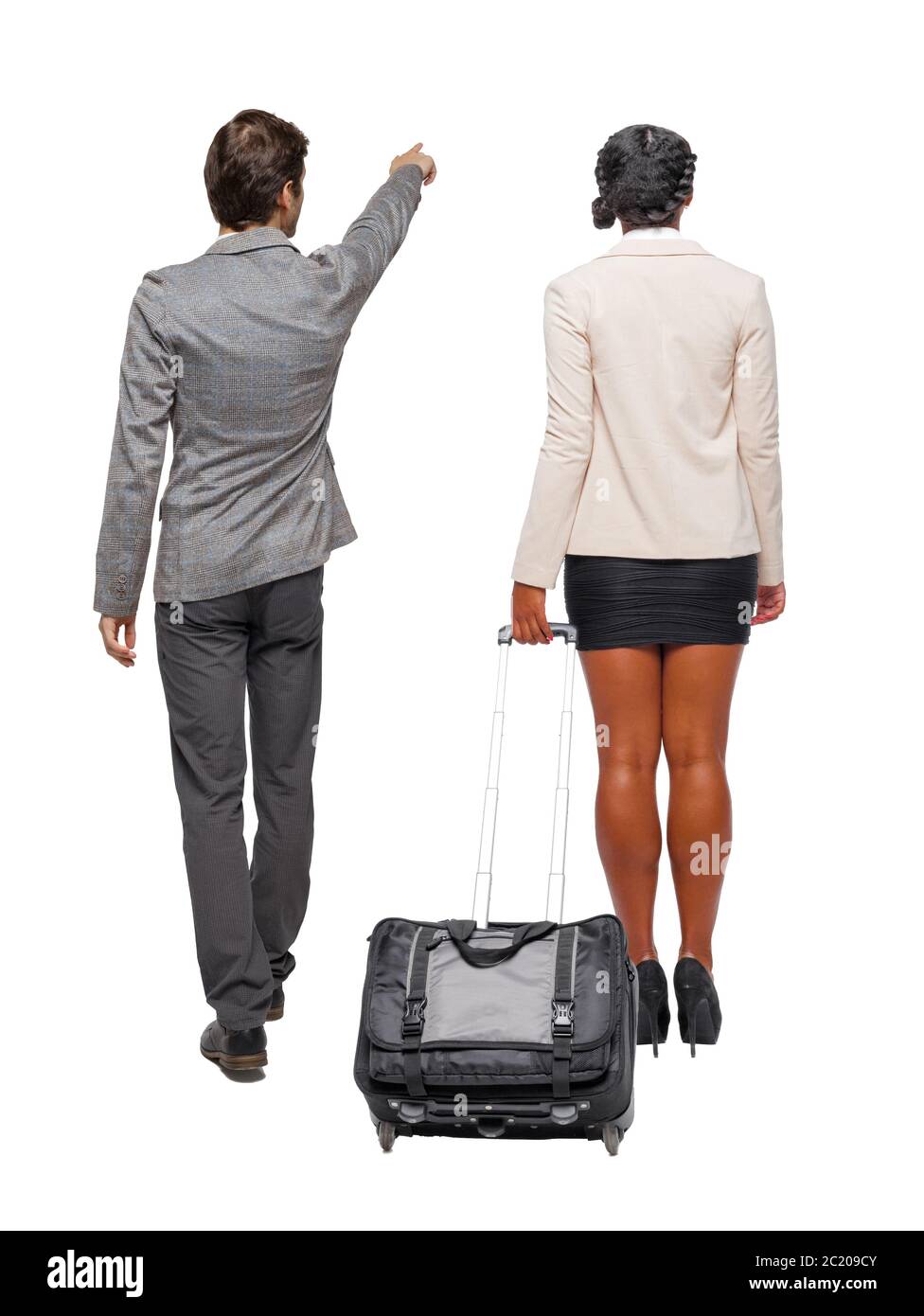 Back view of two business people in suit pointing. Business team. traveling with suitcas. Back view. Rear view people collection. backside view of per Stock Photo