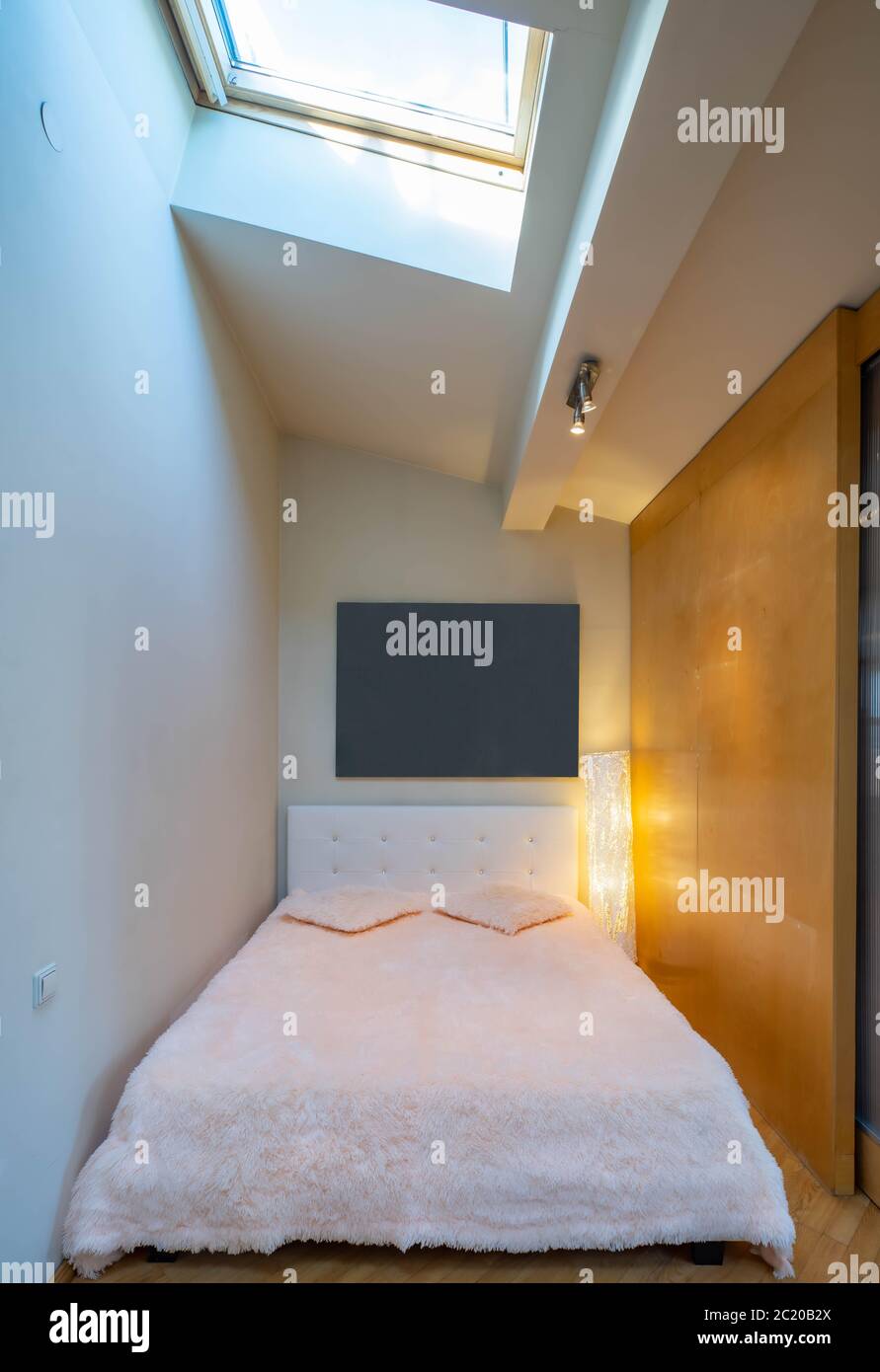 Small bed behind wooden sliding doors. Place for sleeping. Blurred