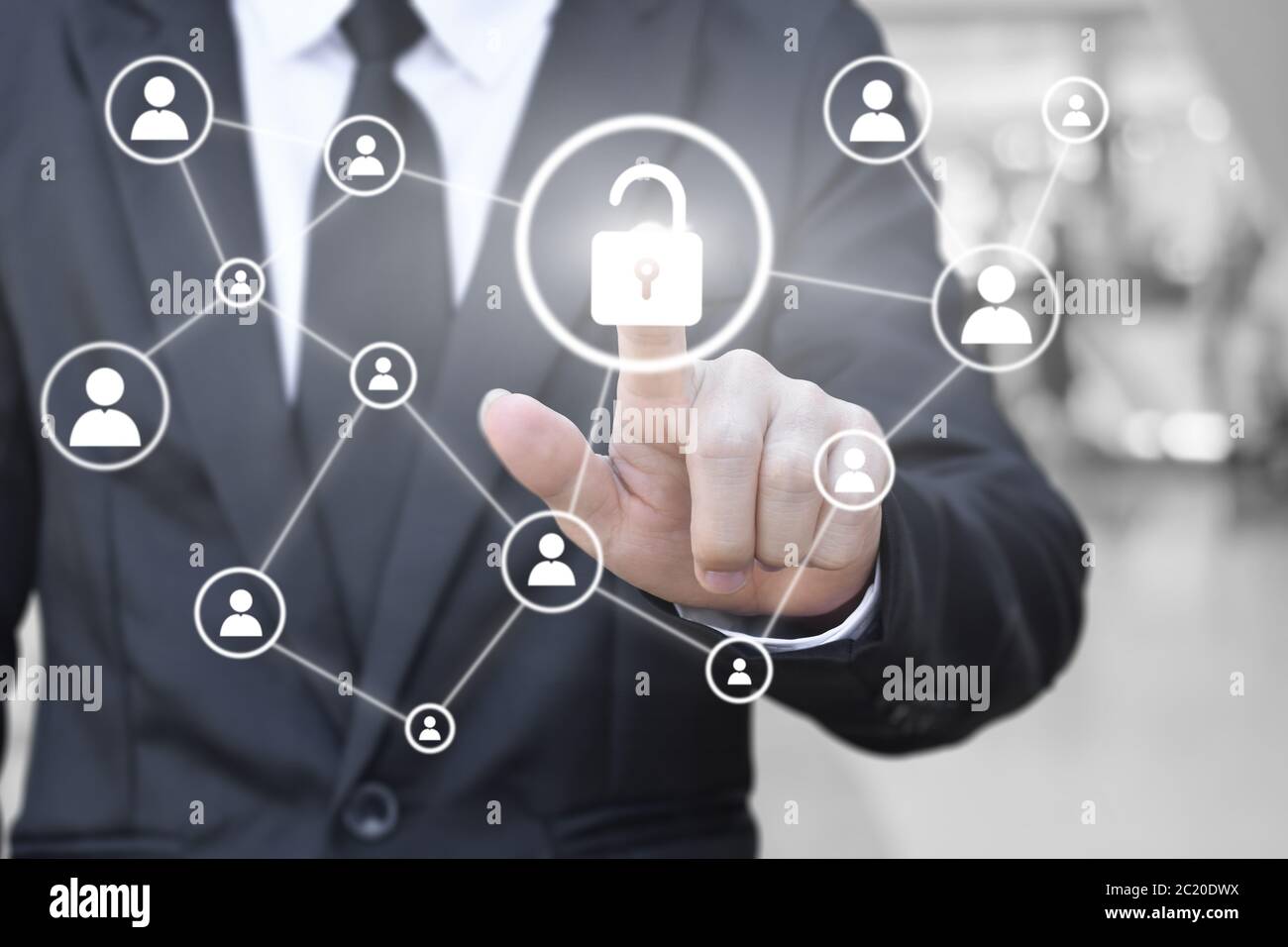 Businessman hand pressing unlock icon on virtual screen for network connection. Concept of global communication in business. Stock Photo