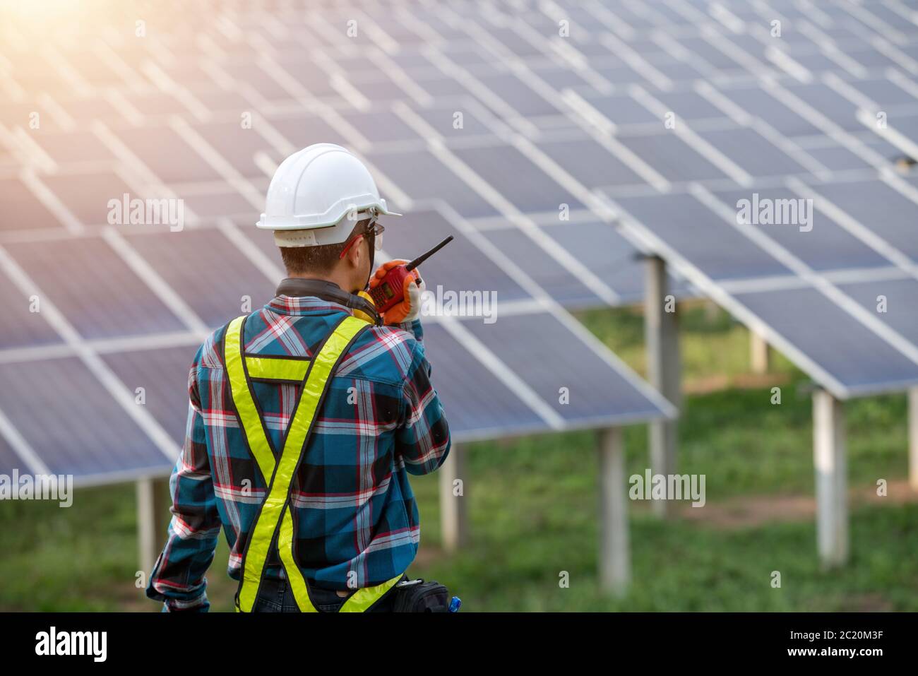 Portrait electrical engineers, solar power operational and command radio communication. Stock Photo