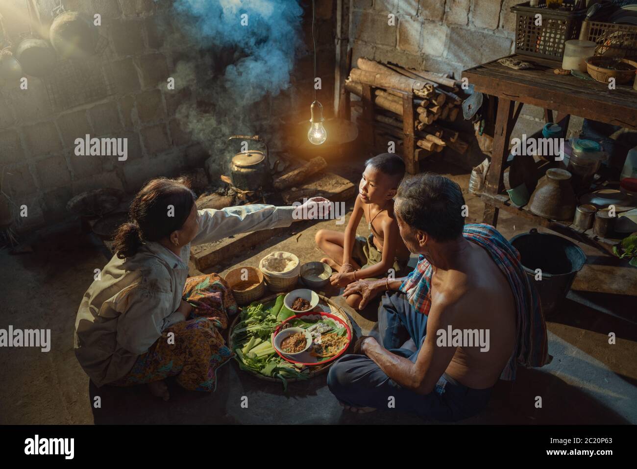 Thai family father mother and son dinner together lifestyles of people in rural Thailand Stock Photo