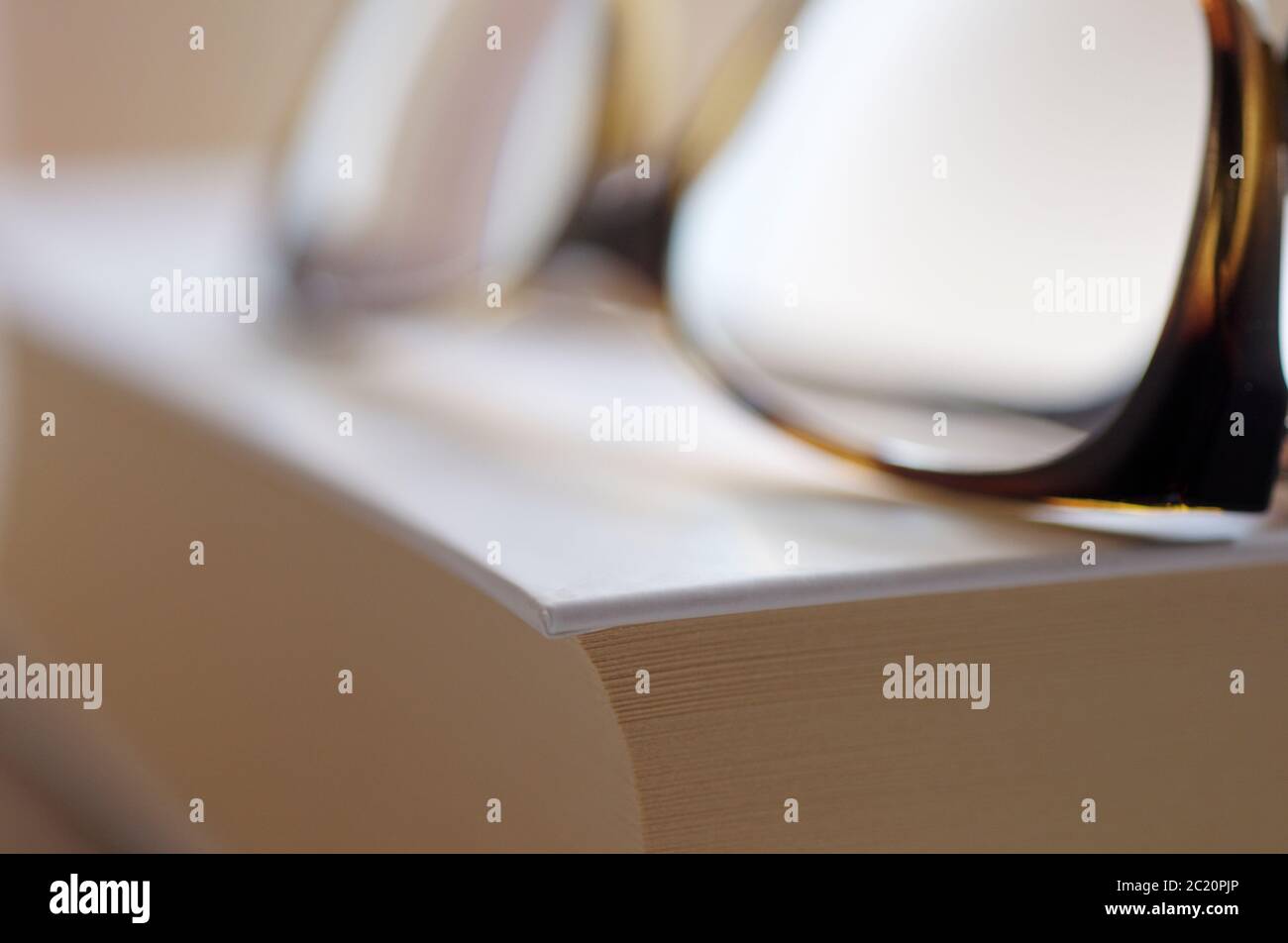 eyeglasses on book Stock Photo