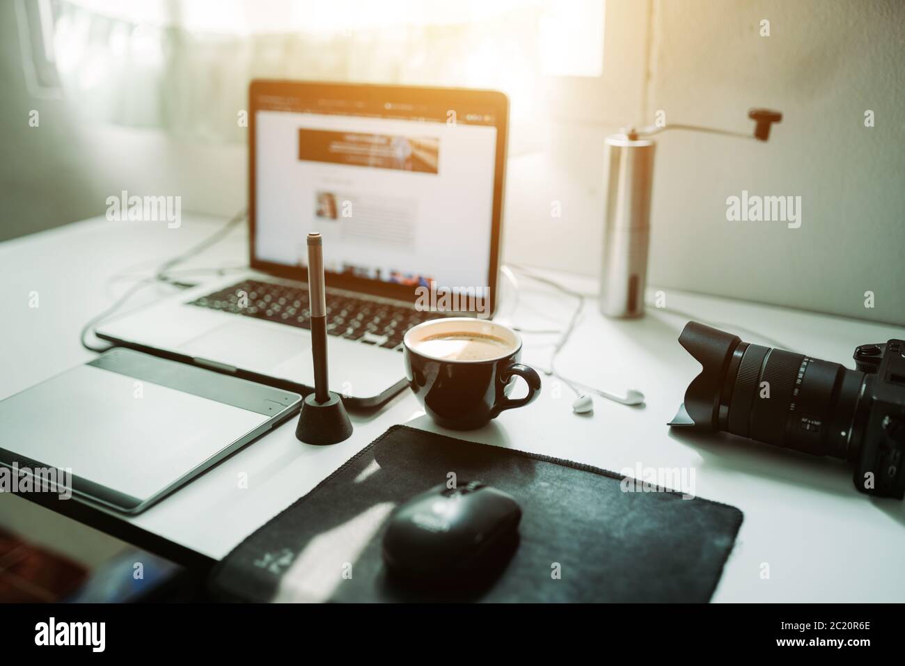 Cappuccino coffee and laptop on the desk working from home of the lifestyle freelance Stock Photo