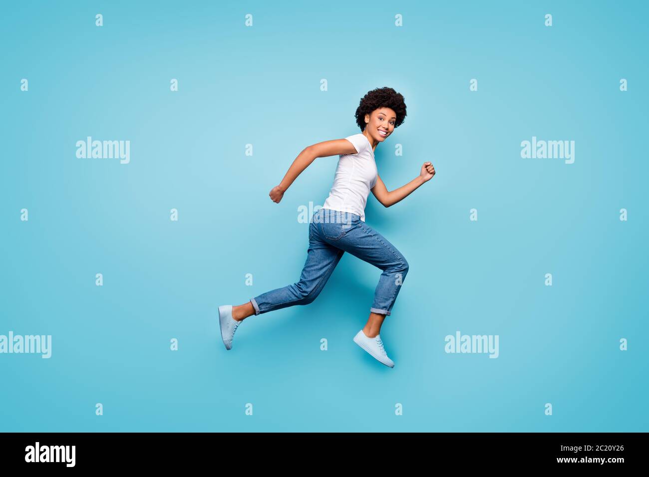 Full body photo of funky dark skin curly lady jumping high rushing ...