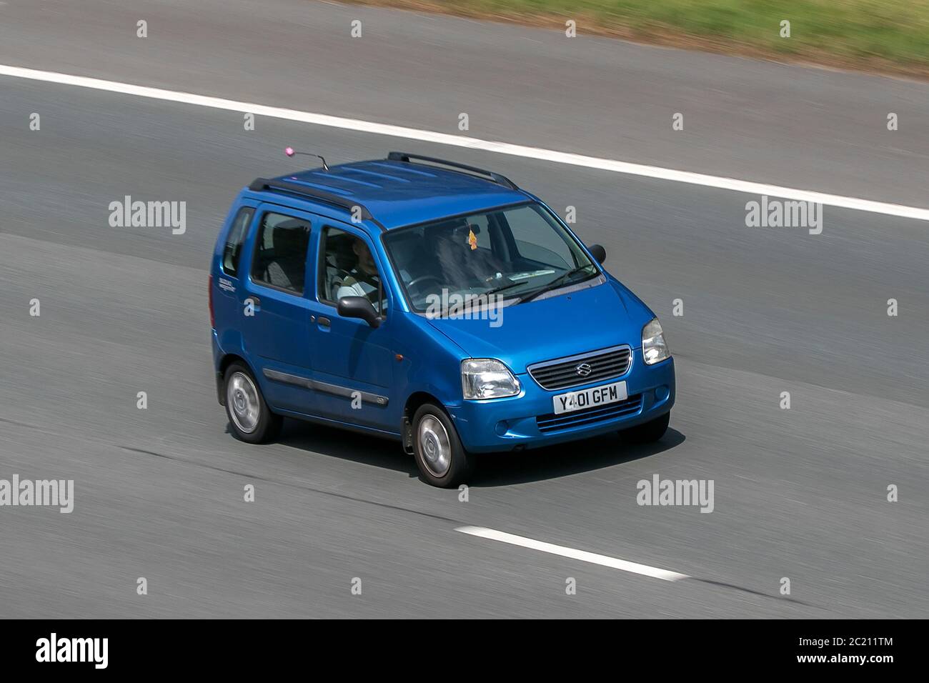 2001 Suzuki Wagon R Blue Car Small MPV Petrol driving on the M6 motorway near Preston in Lancashire, UK Stock Photo