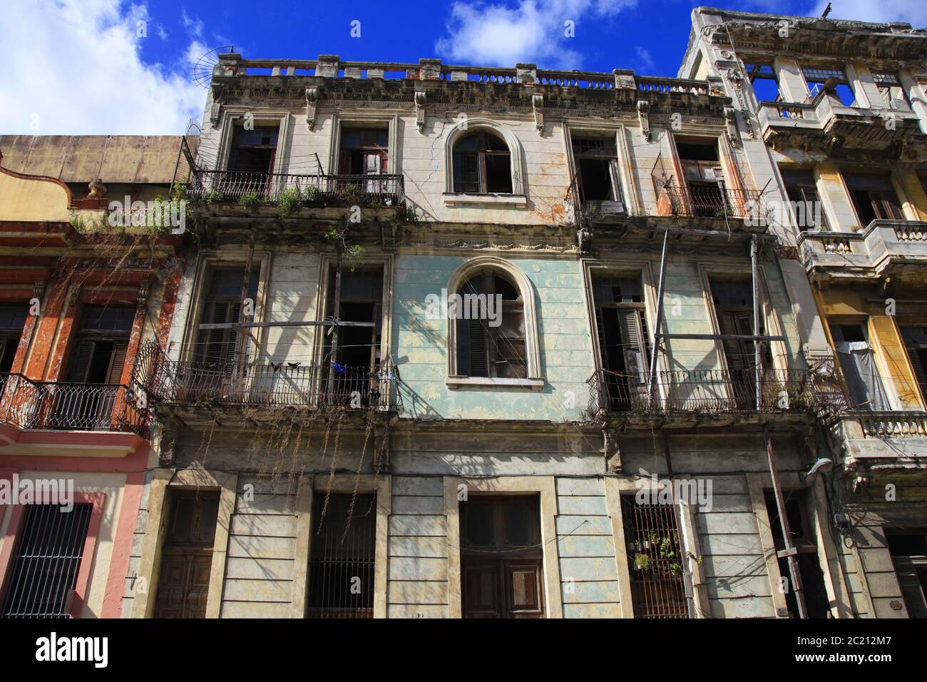 Facade of an old residential building with balconies in Havana, Cuba Stock Photo