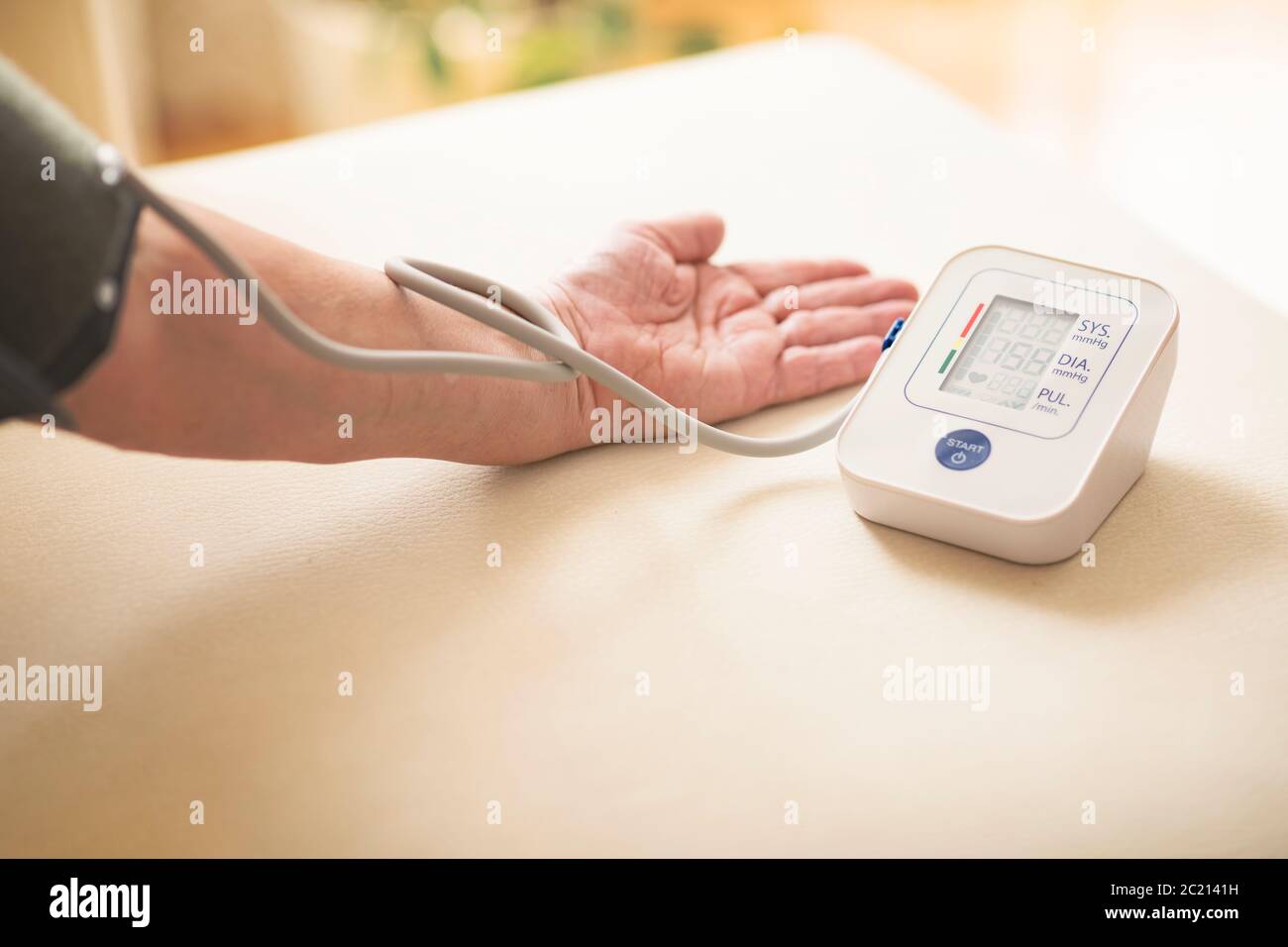 Blood pressure test with digital monitor Stock Photo