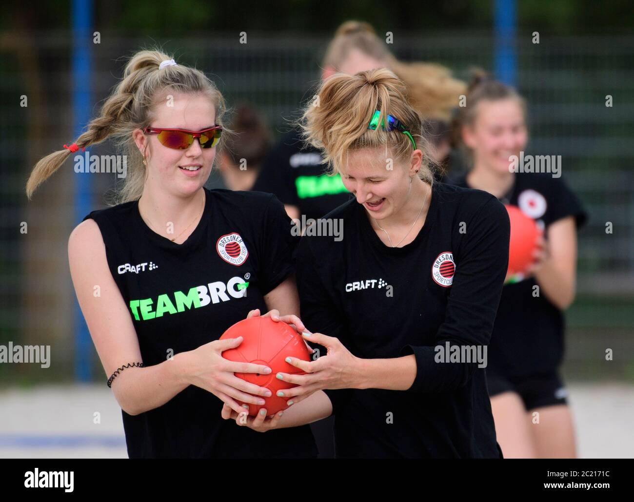 Dresden, Germany. 16th June, 2020. Emma Cyris (l) and Sarah Straube, players at the women's volleyball Bundesliga club Dresdner SC, are training with a medicine ball during an athletics session on the beach volleyball court. Credit: Robert Michael/dpa-Zentralbild/dpa/Alamy Live News Stock Photo