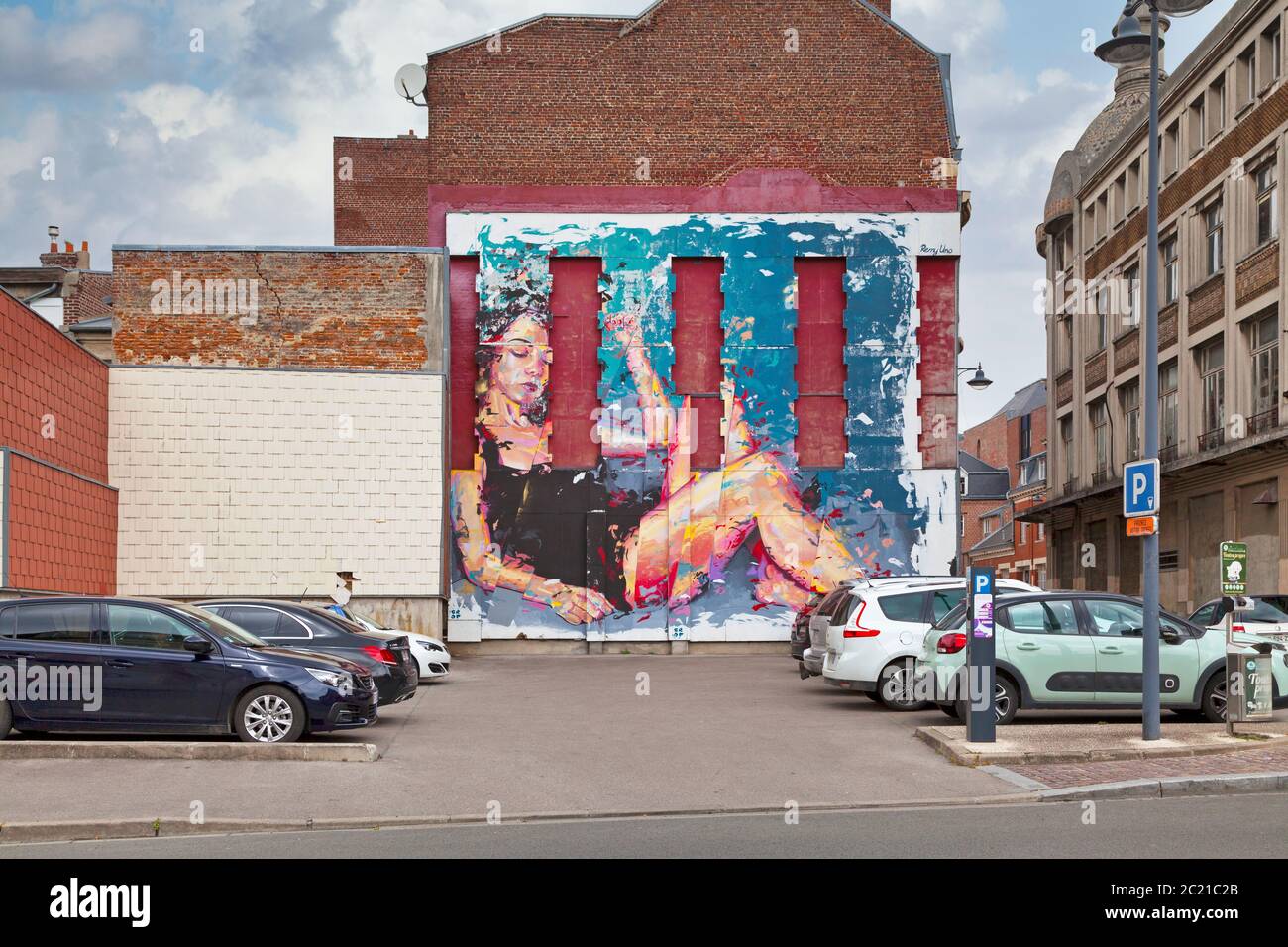 Saint-Quentin, France - June 10 2020: Mural painted on a wall of a parking lot in the city center by artist Remy Uno. Stock Photo