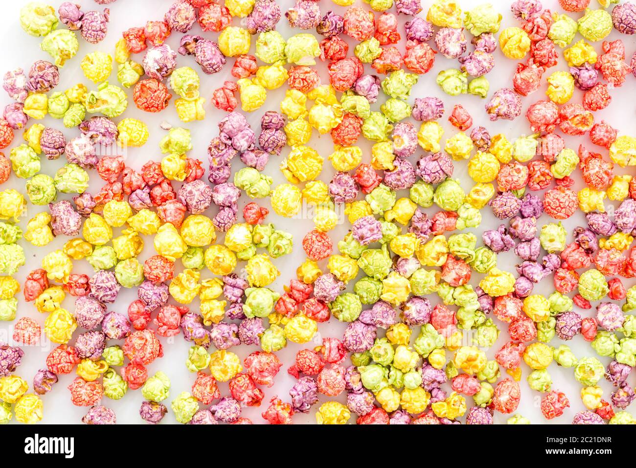 Colored popcorn on white background top view Stock Photo