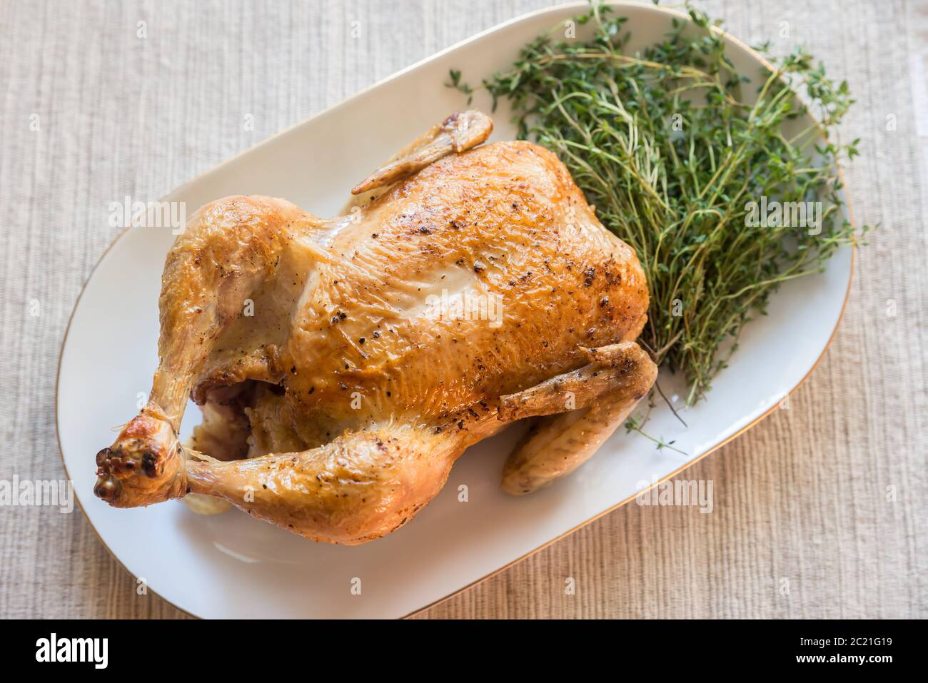 Roasted chicken with fresh thyme Stock Photo