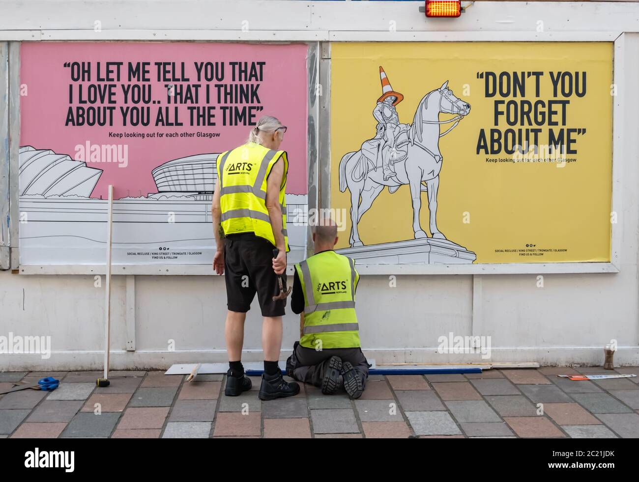 Glasgow Scotland Uk 16th June 2020 Two Members Of Jack Arts Scotland Fixing Posters Showing Glasgow Landmarks Along With Song Lyrics One Poster Shows A Drawing Of The Armadillo And The Sse