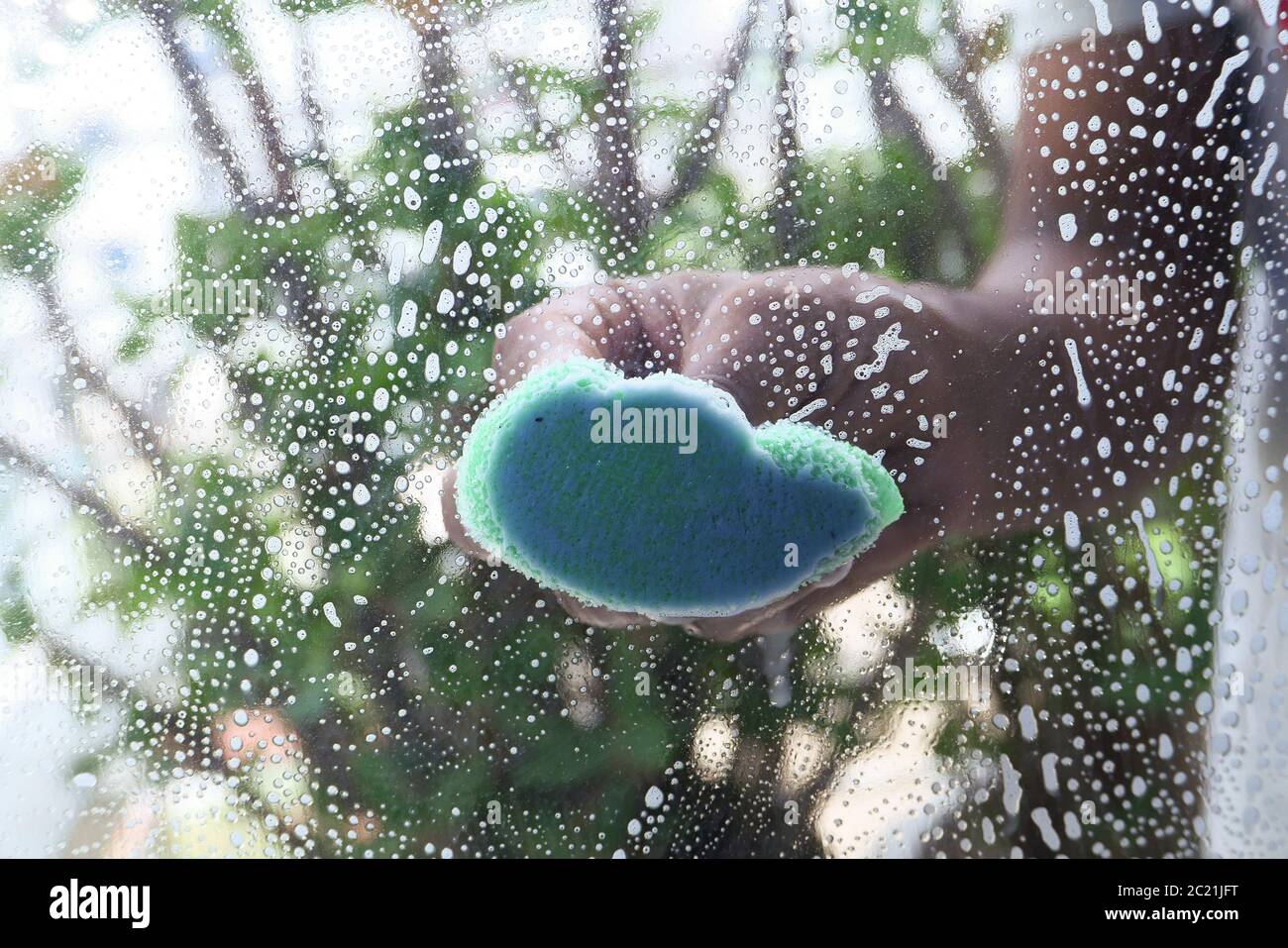 Hand cleaning window hi-res stock photography and images - Alamy