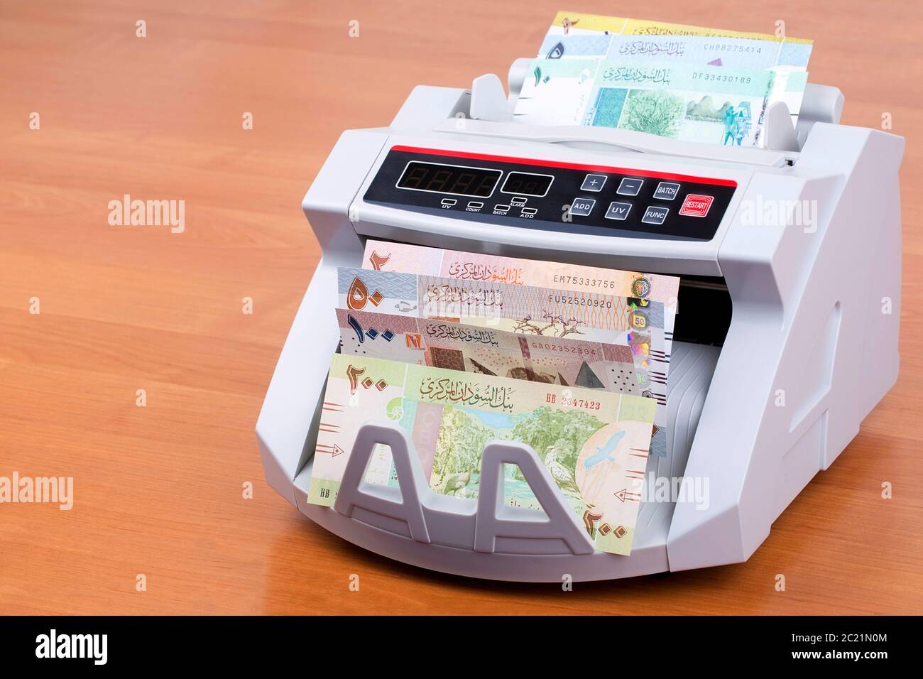 Sudanese Pounds in a counting machine Stock Photo