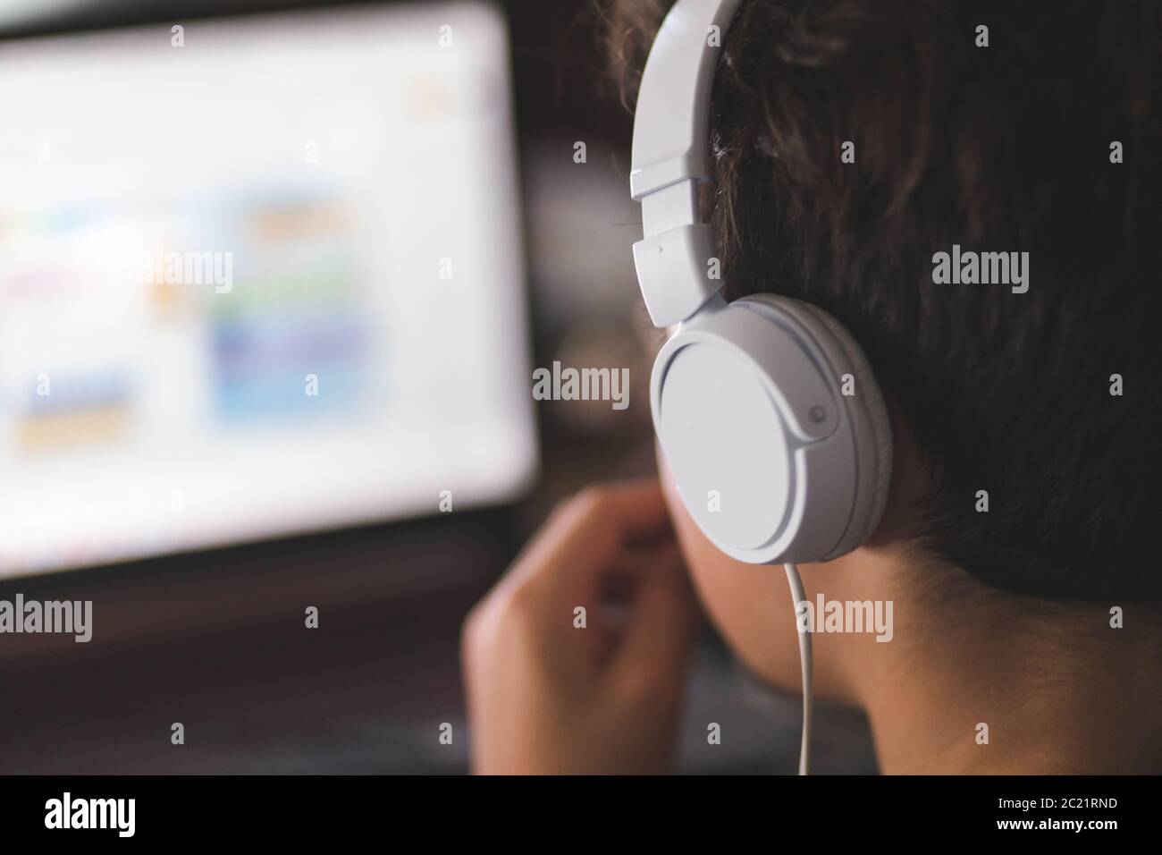Boy doing his homework on laptop Stock Photo