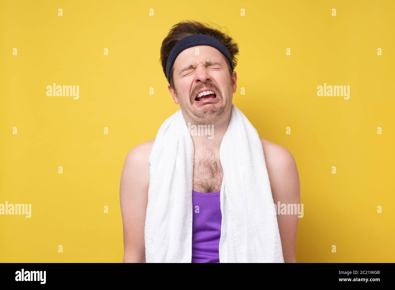 Young caucasian sport man whining and crying being exhausted Stock Photo