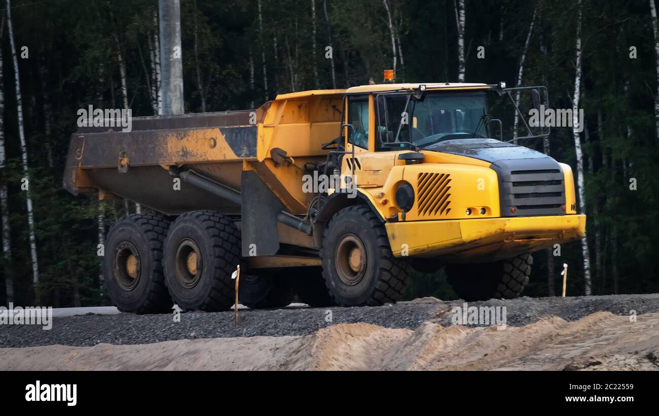 Road-building. Bulldozer, excavator and dump truck operation Stock Photo