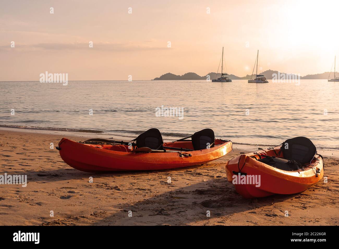 Kayaks on sandy beach Stock Photo - Alamy
