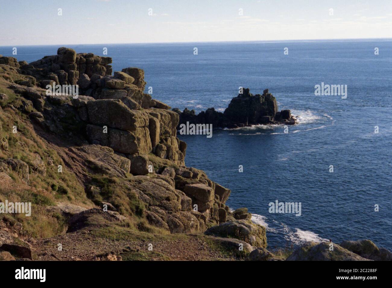 Lands End Rocky Outcrop looking out to Sea Cornwall,West Country,Blue Sky Lands End,Natural lighting, Natural Landscape, Unfiltered Stock Photo