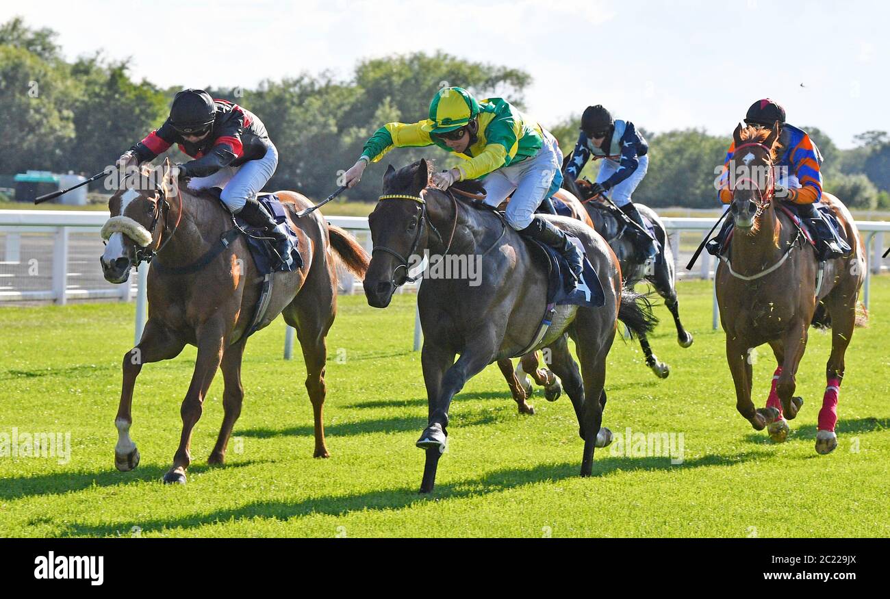 Ivadream ridden by jockey Jason Watson wins the Follow At The Races On Twitter Handicap at Windsor Racecourse. Stock Photo