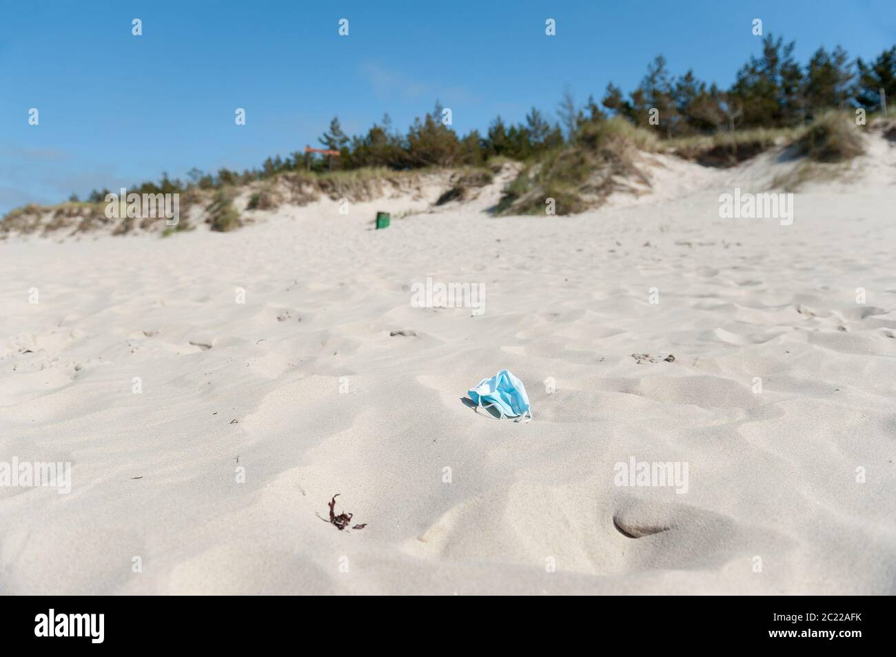 Anti virus mask on a beach near Łeba, Slowiński National Park, Pomeranian Voivodeship, Poland Stock Photo