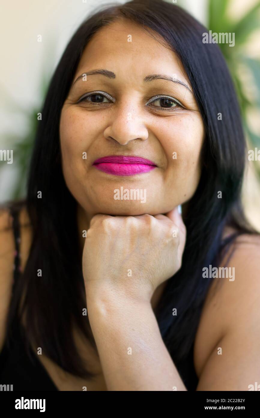 Portrait of a beautiful smiling middle aged Asian woman Stock Photo - Alamy