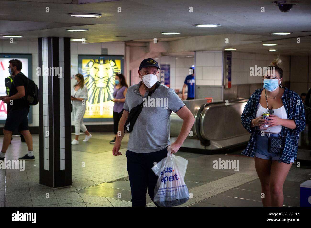 Londoners travel via Oxford Circus station on the first day of non-essential shops trading since the COVID-19 lockdown began. London, UK. 15 June 2020 Stock Photo