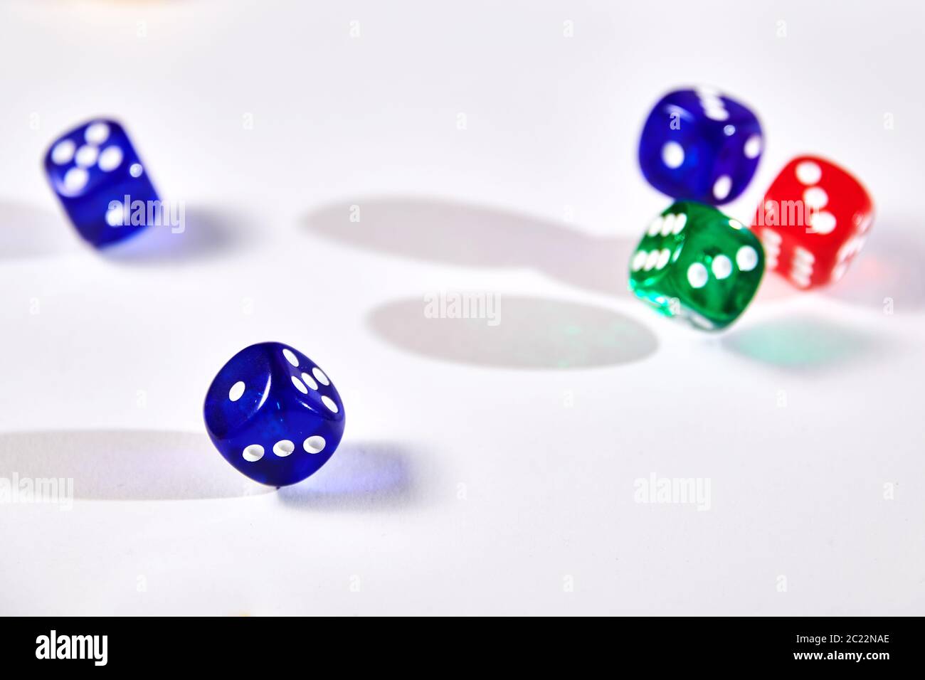 colorful dices in motion on white background Stock Photo