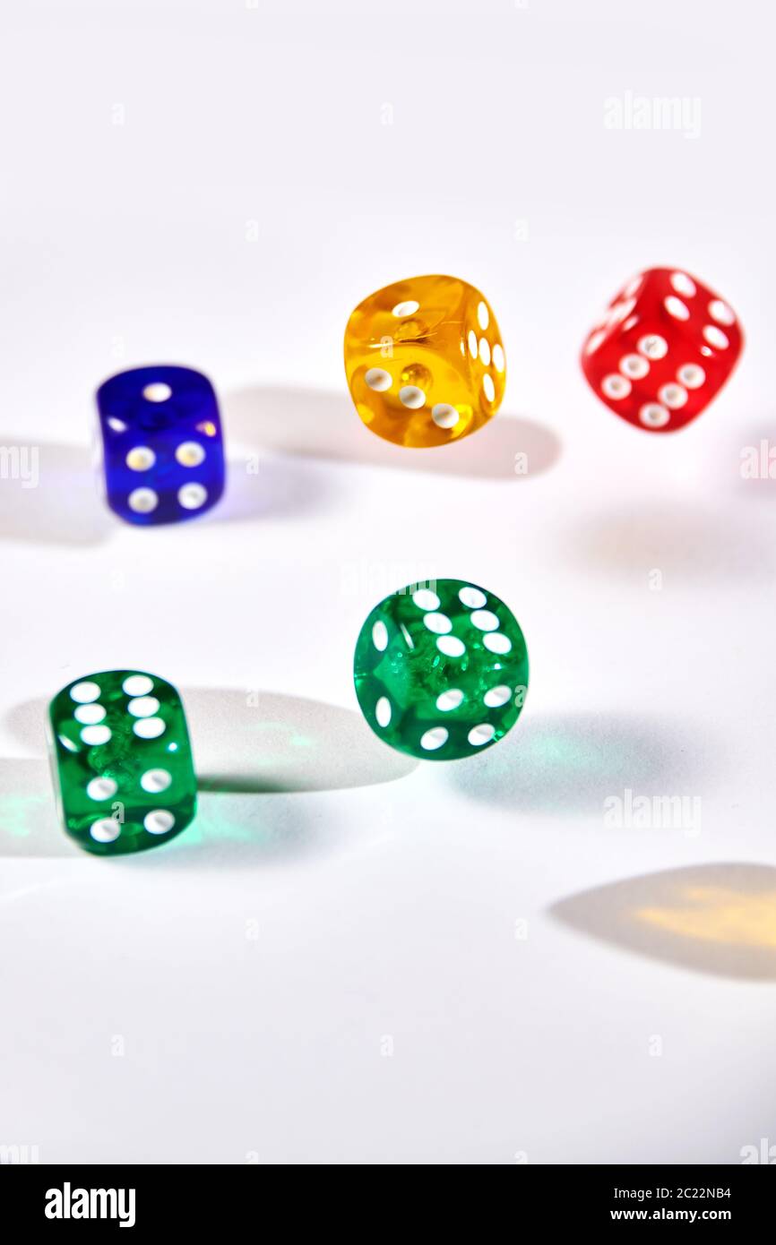 colorful dices in motion on white background Stock Photo