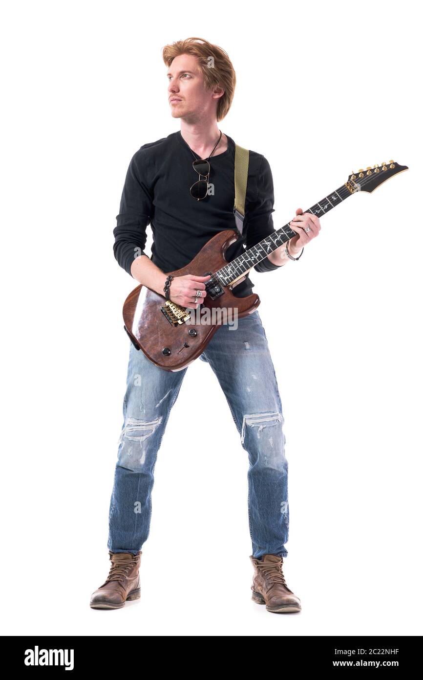 Cool handsome confident young rock music guitarist playing electric guitar  looking up. Full body length isolated on white background Stock Photo -  Alamy