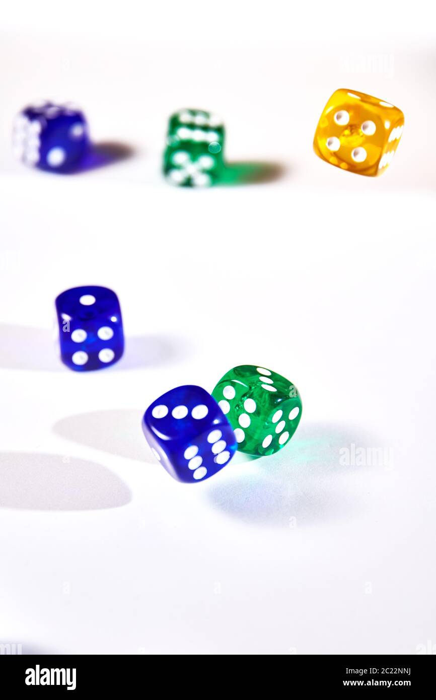 colorful dices in motion on white background Stock Photo